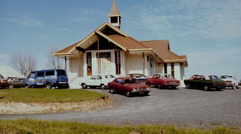 A church with cars parked outside